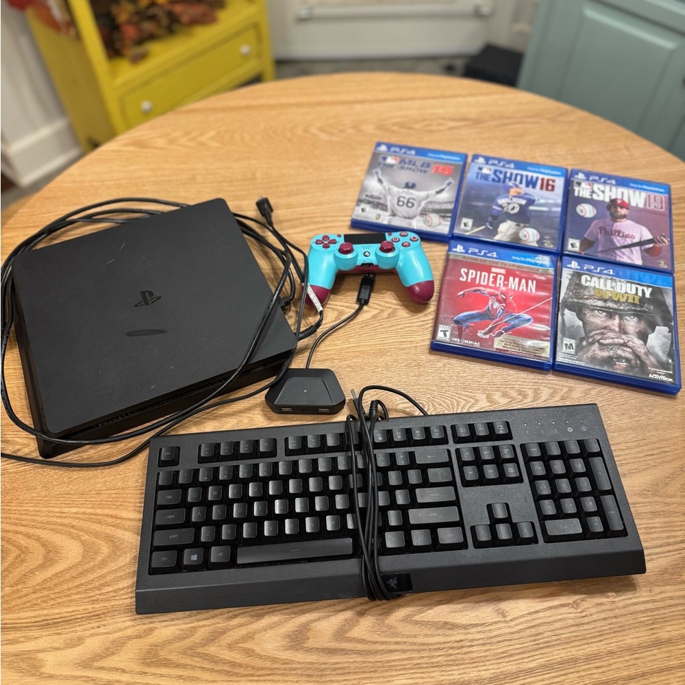 Sony PlayStation 4 Console with Black Keyboard and 5 Games